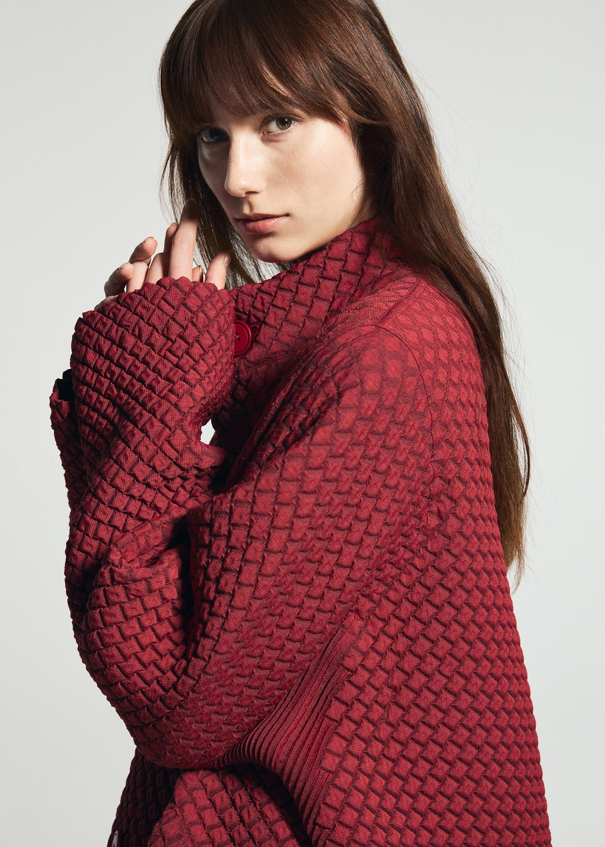 A model wears the A-POC ABLE ISSEY MIYAKE TYPE-O 024 type-o-024-coat-red.