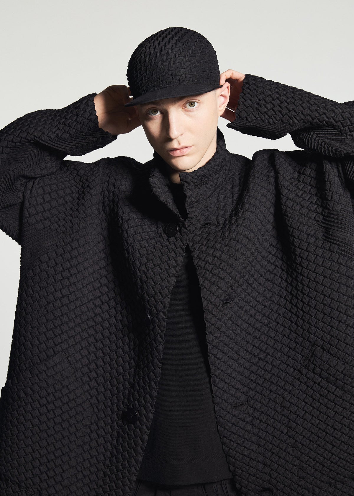 A model wears the A-POC ABLE ISSEY MIYAKE TYPE-O 024 type-o-024-coat-beige.