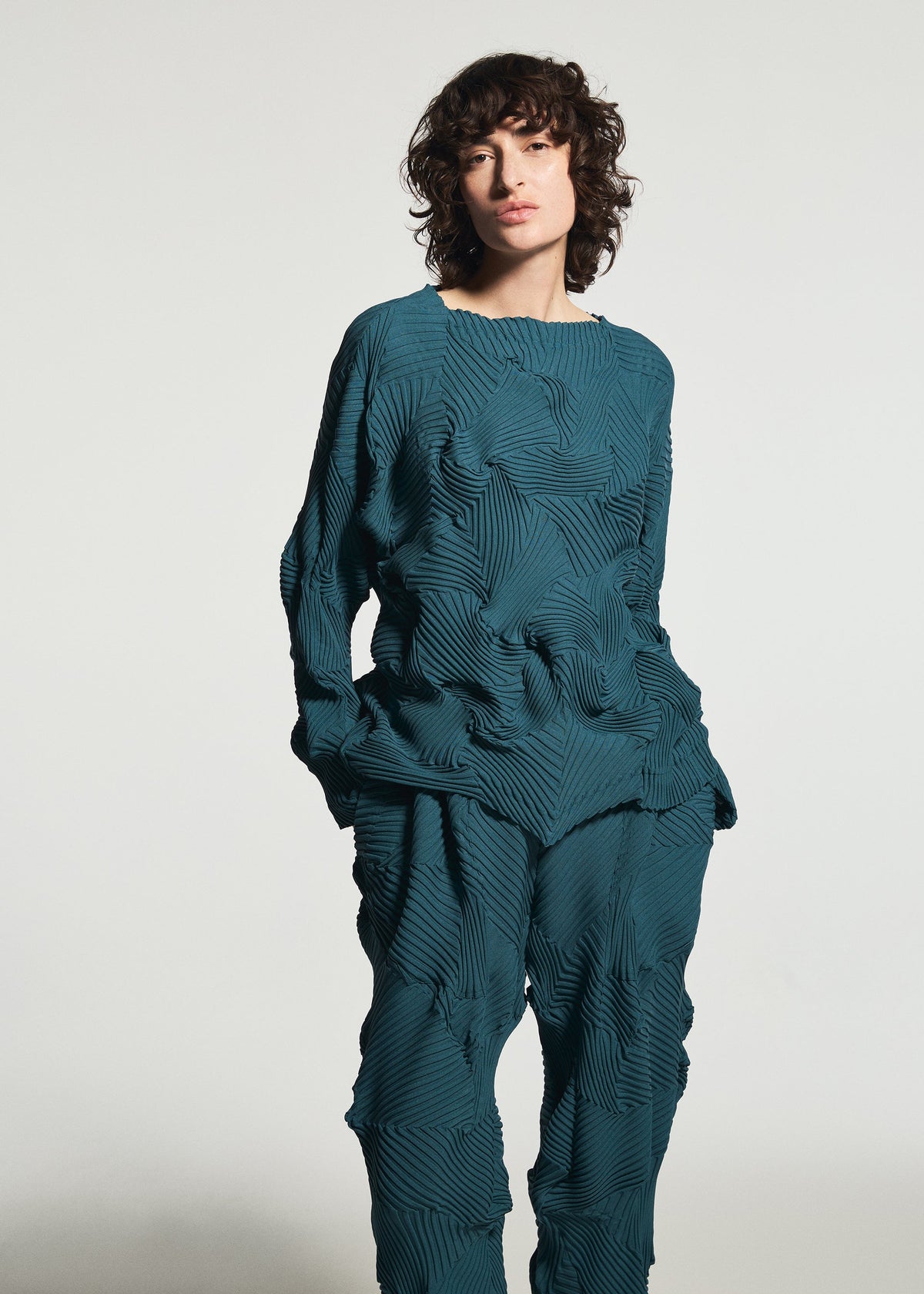 A model wears the A-POC ABLE ISSEY MIYAKE TYPE-P 003-1 type-p-003-1-top-turquoise-green.