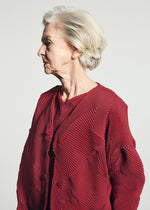 A model wears the A-POC ABLE ISSEY MIYAKE TYPE-O 010-1 type-o-010-1-cardigan-grey-hued.