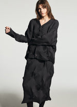 A model wears the A-POC ABLE ISSEY MIYAKE TYPE-O 010-1 type-o-010-1-cardigan-grey-hued.