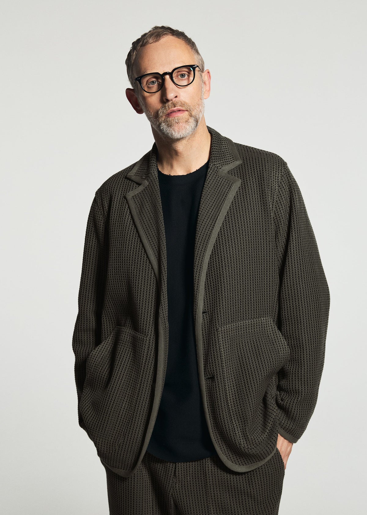 A model wears the A-POC ABLE ISSEY MIYAKE TYPE-K 012 type-k-012-jacket-beige-hued.