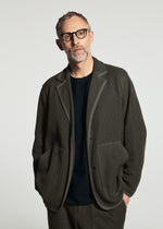 A model wears the A-POC ABLE ISSEY MIYAKE TYPE-K 012 type-k-012-jacket-black-hued.
