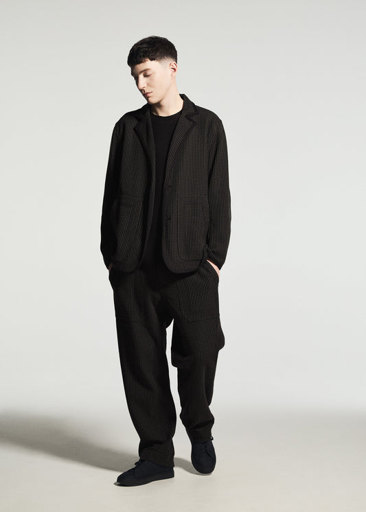 A model wears the A-POC ABLE ISSEY MIYAKE TYPE-K 012 type-k-012-trousers-black-hued.