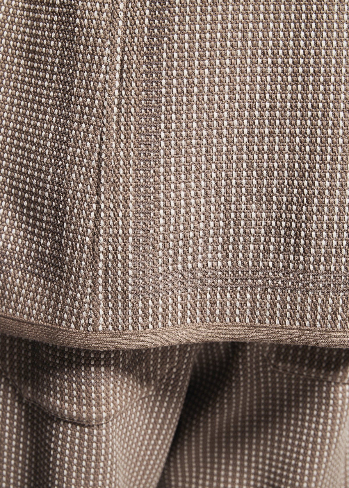 A model wears the A-POC ABLE ISSEY MIYAKE TYPE-K 012 type-k-012-trousers-beige-hued.