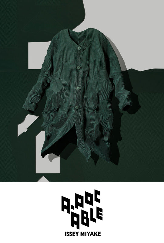 Top: TYPE-O 017 Coat in Dark Green suspended mid-air. Background: A white sheet of trouser pattern against dark green background. Bottom: A-POC ABLE ISSEY MIYAKE logo in black on white background.