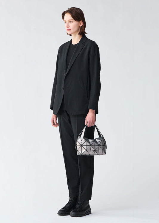 A model wears the BAO BAO ISSEY MIYAKE BOSTON hand bag.