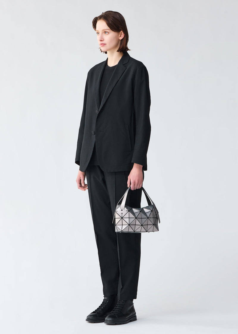 A model wears the BAO BAO ISSEY MIYAKE BOSTON hand bag.