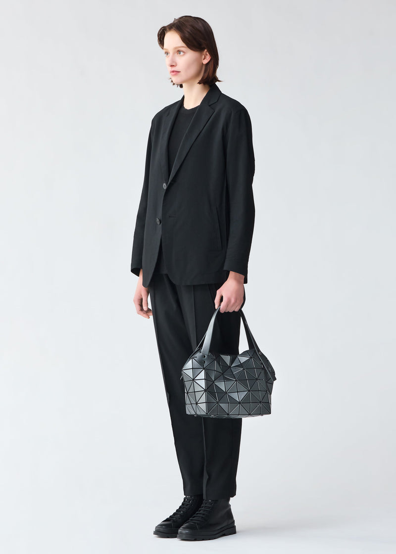 A model wears the BAO BAO ISSEY MIYAKE BOSTON hand bag.