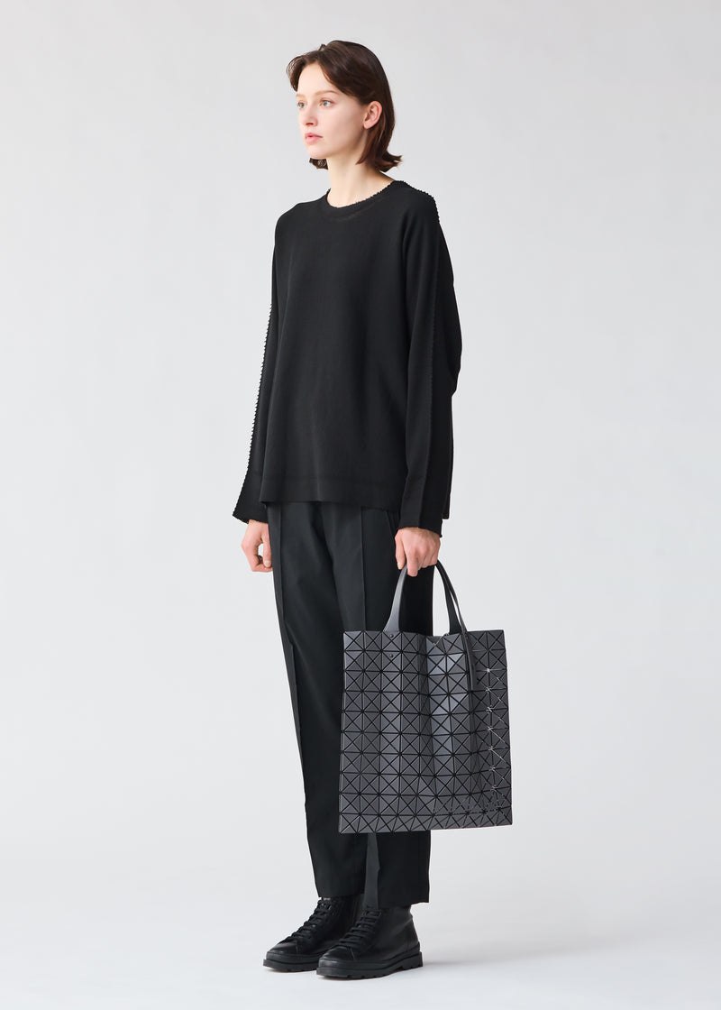 A model wears the BAO BAO ISSEY MIYAKE  PRISM MATTE tote