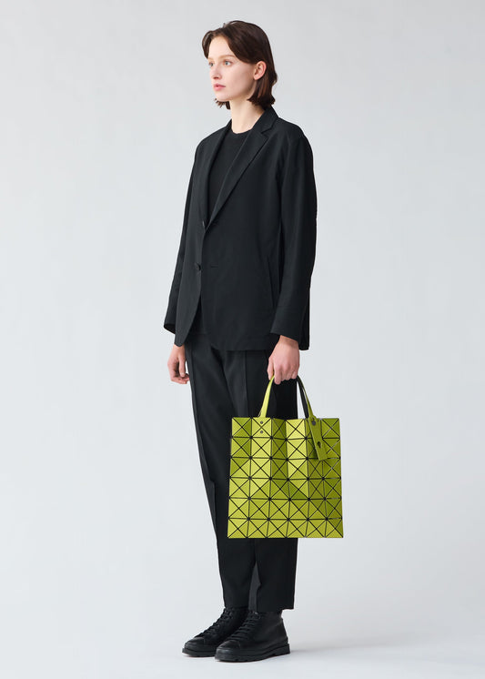 A model wears the BAO BAO ISSEY MIYAKE LUCENT METALLIC tote.