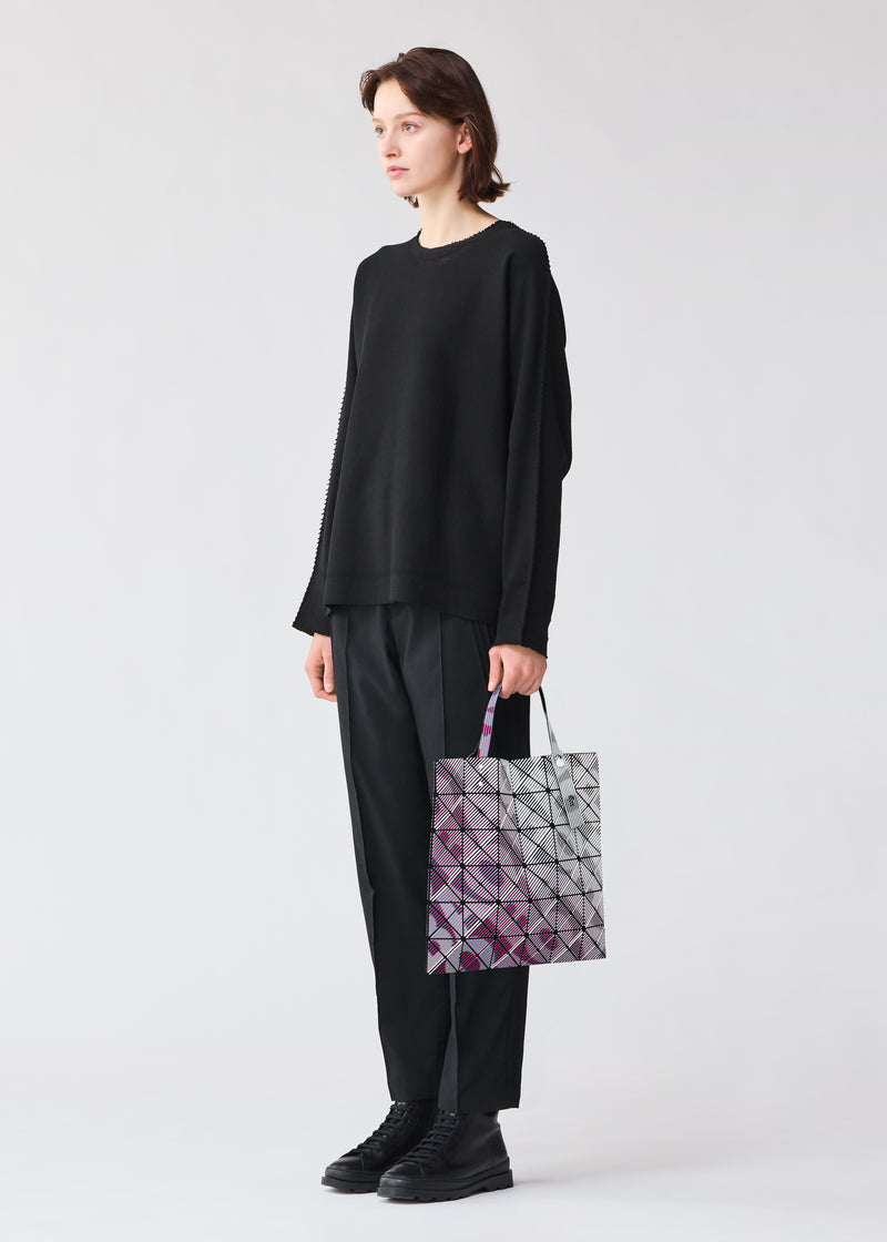 A model wears the BAO BAO ISSEY MIYAKE  BEAM tote