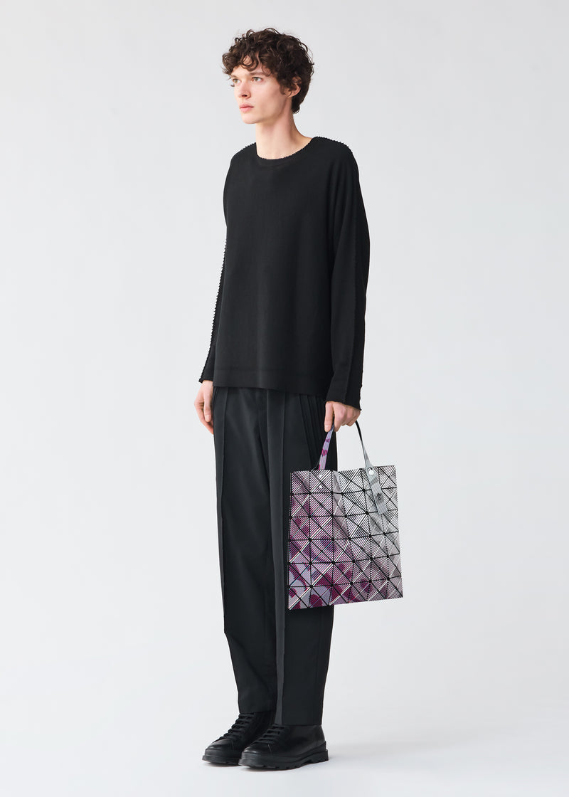 A model wears the BAO BAO ISSEY MIYAKE  BEAM tote