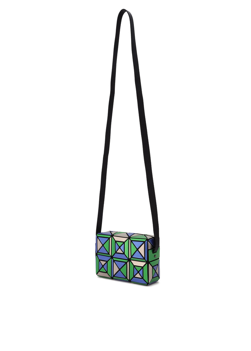 A detail shot of the BAO BAO ISSEY MIYAKE ENSEMBLE shoulder bag.