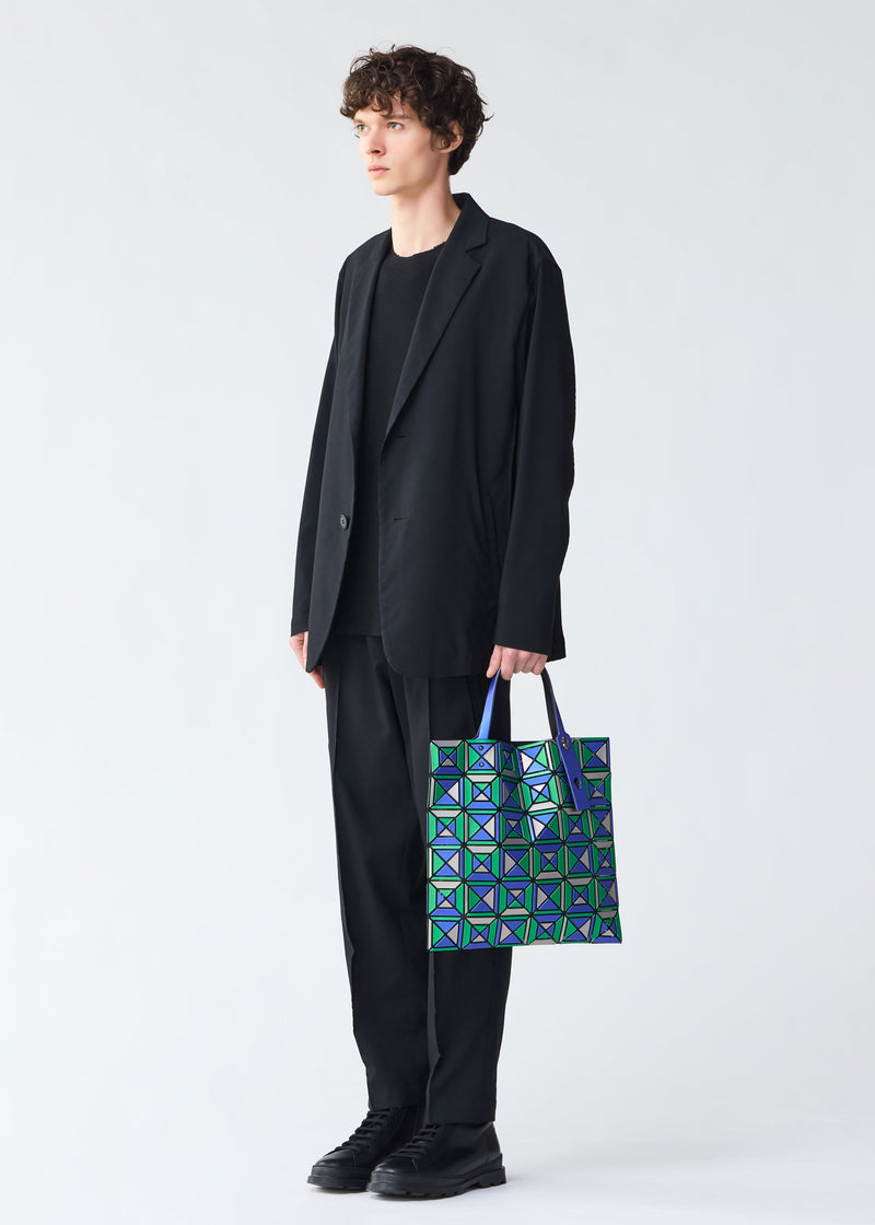 A model wears the BAO BAO ISSEY MIYAKE ENSEMBLE tote.