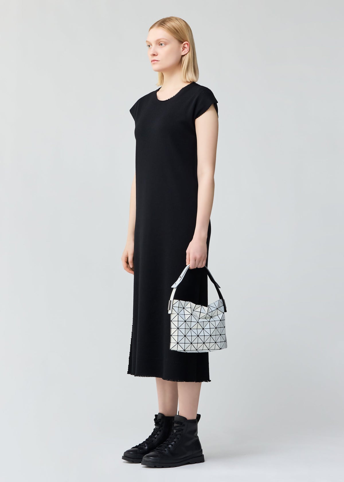 A model wears the BAO BAO ISSEY MIYAKE BAGUETTE .
