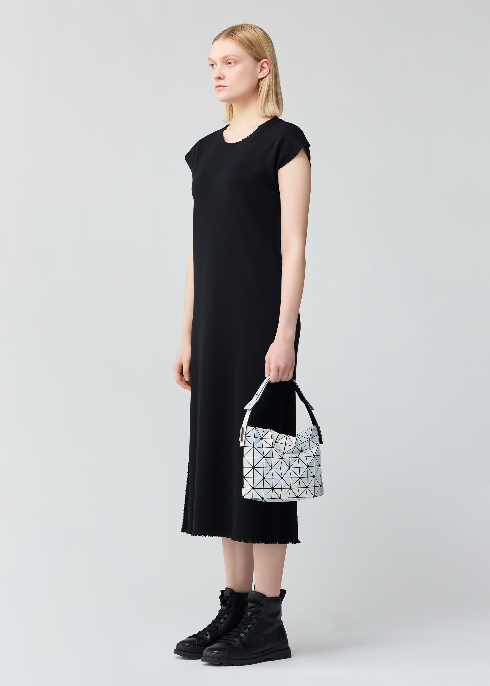 A model wears the BAO BAO ISSEY MIYAKE BAGUETTE .