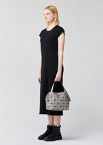 A model wears the BAO BAO ISSEY MIYAKE BOSTON shoulder bag.