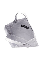 A detail shot of the BAO BAO ISSEY MIYAKE FONT tote.