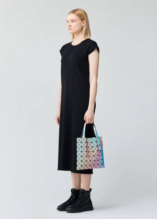 A model wears the BAO BAO ISSEY MIYAKE ILLUSION tote.