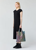 A model wears the BAO BAO ISSEY MIYAKE ILLUSION tote.