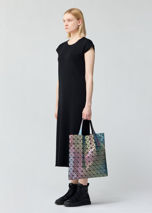 A model wears the BAO BAO ISSEY MIYAKE ILLUSION tote.