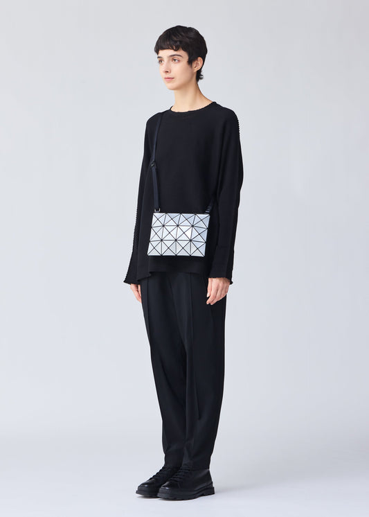 A model wears the BAO BAO ISSEY MIYAKE LUCENT crossbody.