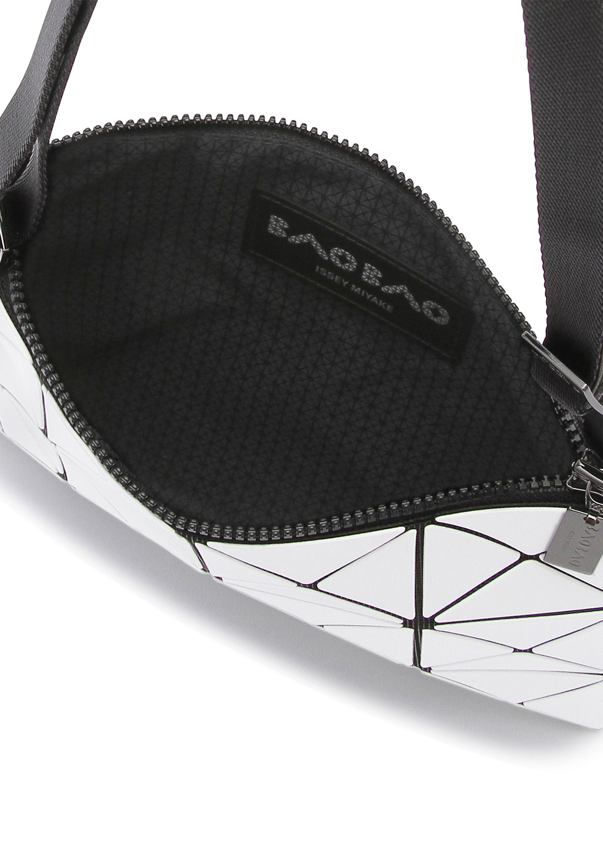 A detail shot of the BAO BAO ISSEY MIYAKE LUCENT crossbody.