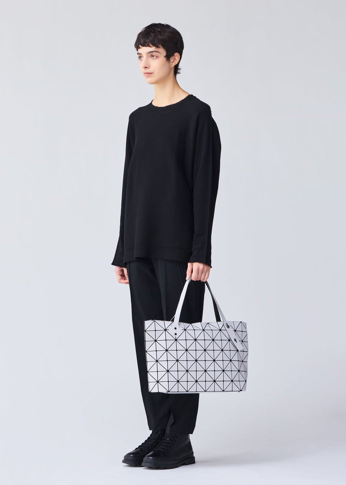 A model wears the BAO BAO ISSEY MIYAKE ROCK MATTE 0.