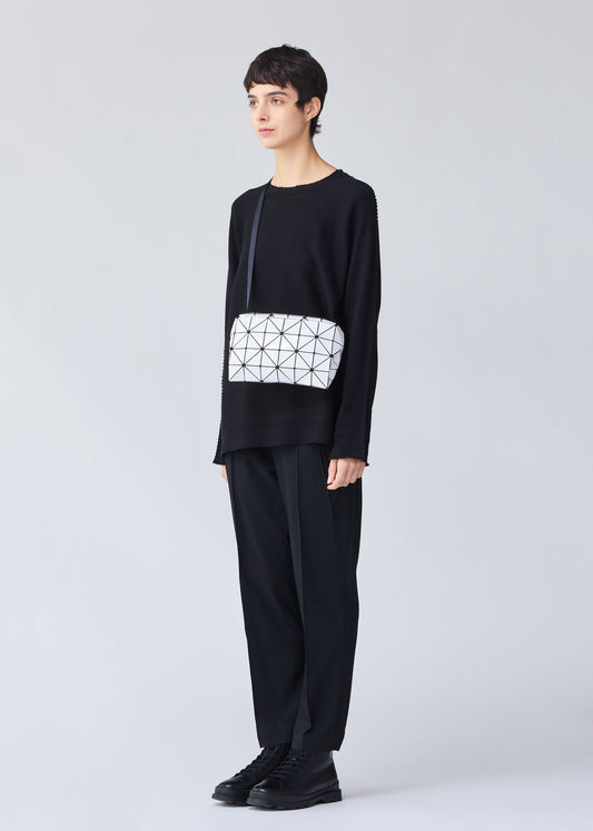 A model wears the BAO BAO ISSEY MIYAKE CARTON shoulder bag.
