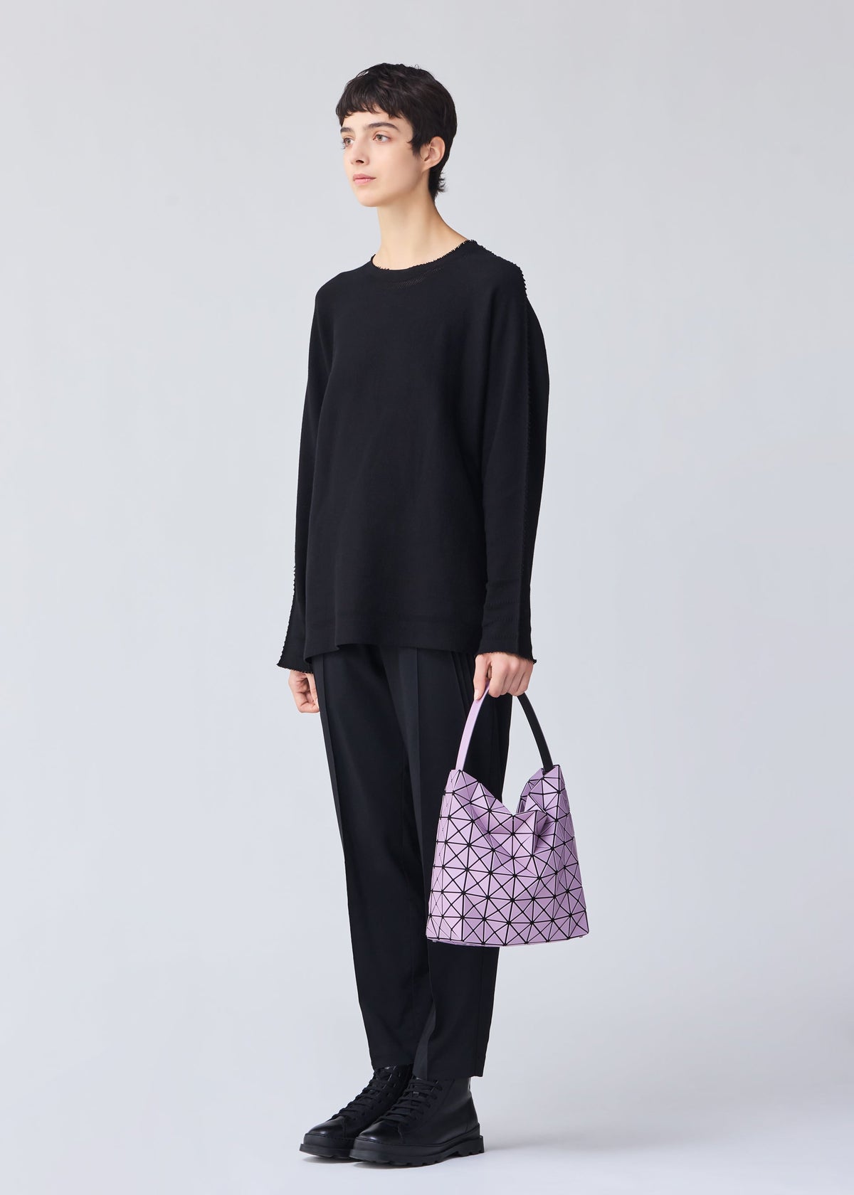 A model wears the BAO BAO ISSEY MIYAKE VALLEY 0.