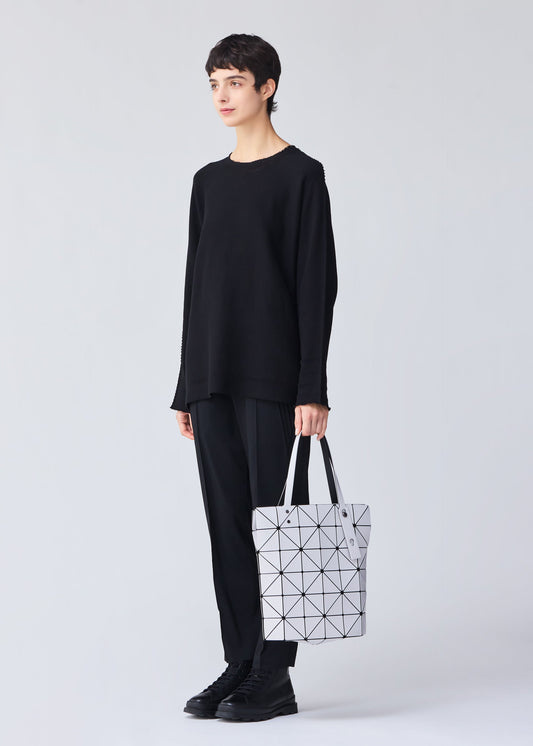 A model wears the BAO BAO ISSEY MIYAKE BLOCKY tote.
