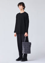 A model wears the BAO BAO ISSEY MIYAKE BLOCKY tote.
