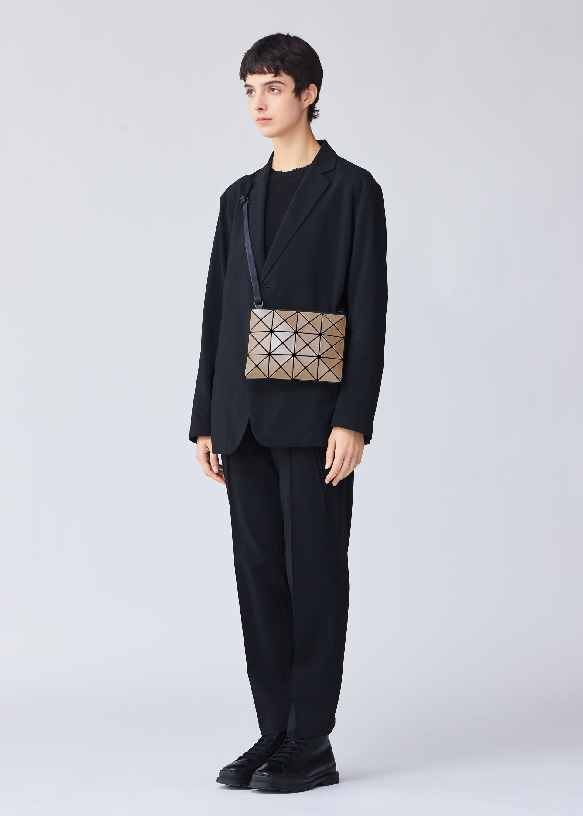 A model wears the BAO BAO ISSEY MIYAKE LUCENT METALLIC crossbody.