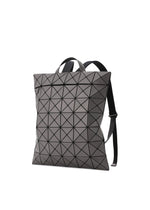 A product shot of the BAO BAO ISSEY MIYAKE FLAT PACK backpack in charcoal grey (14).