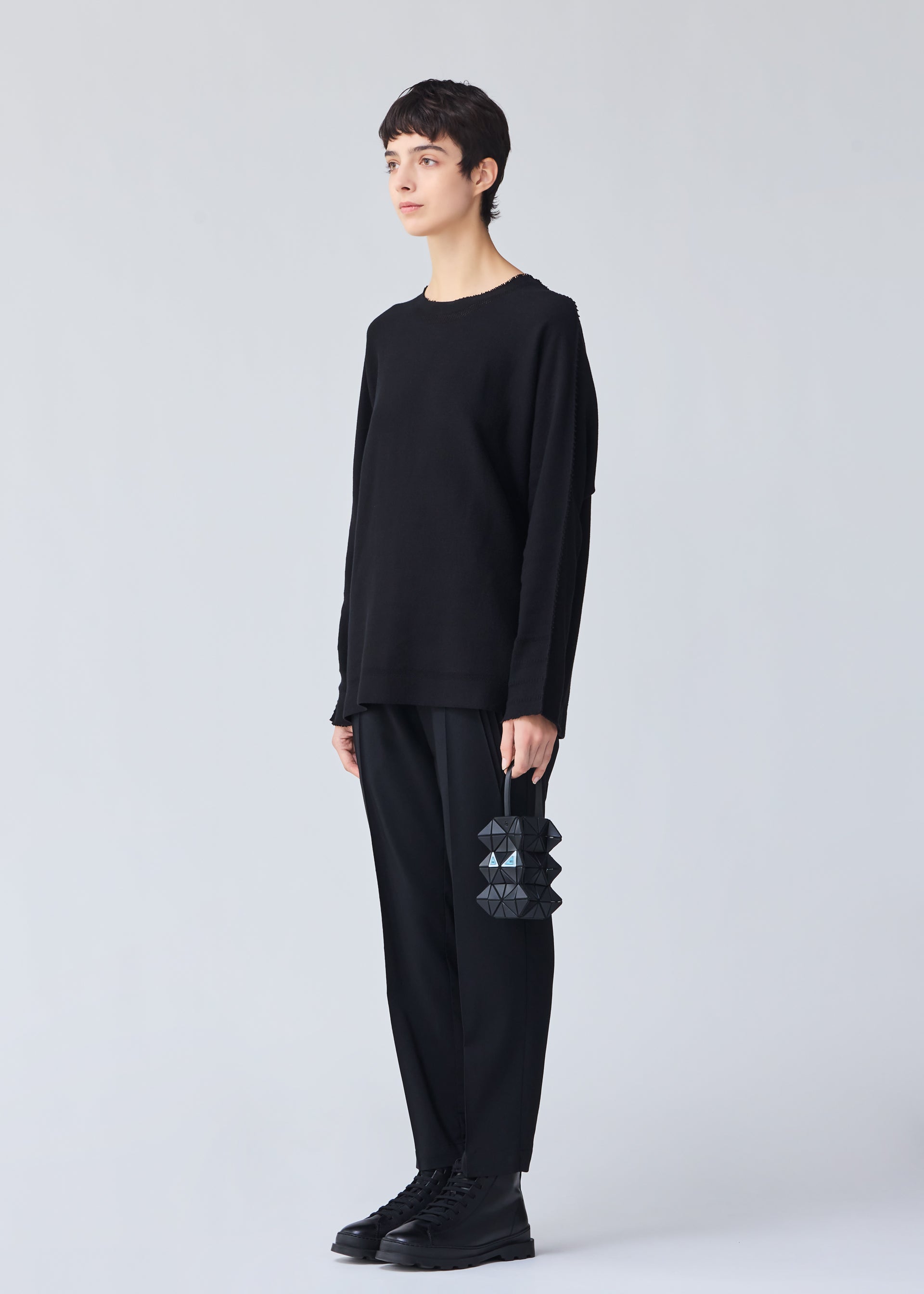 A model wears the BAO BAO ISSEY MIYAKE MEOW 0.