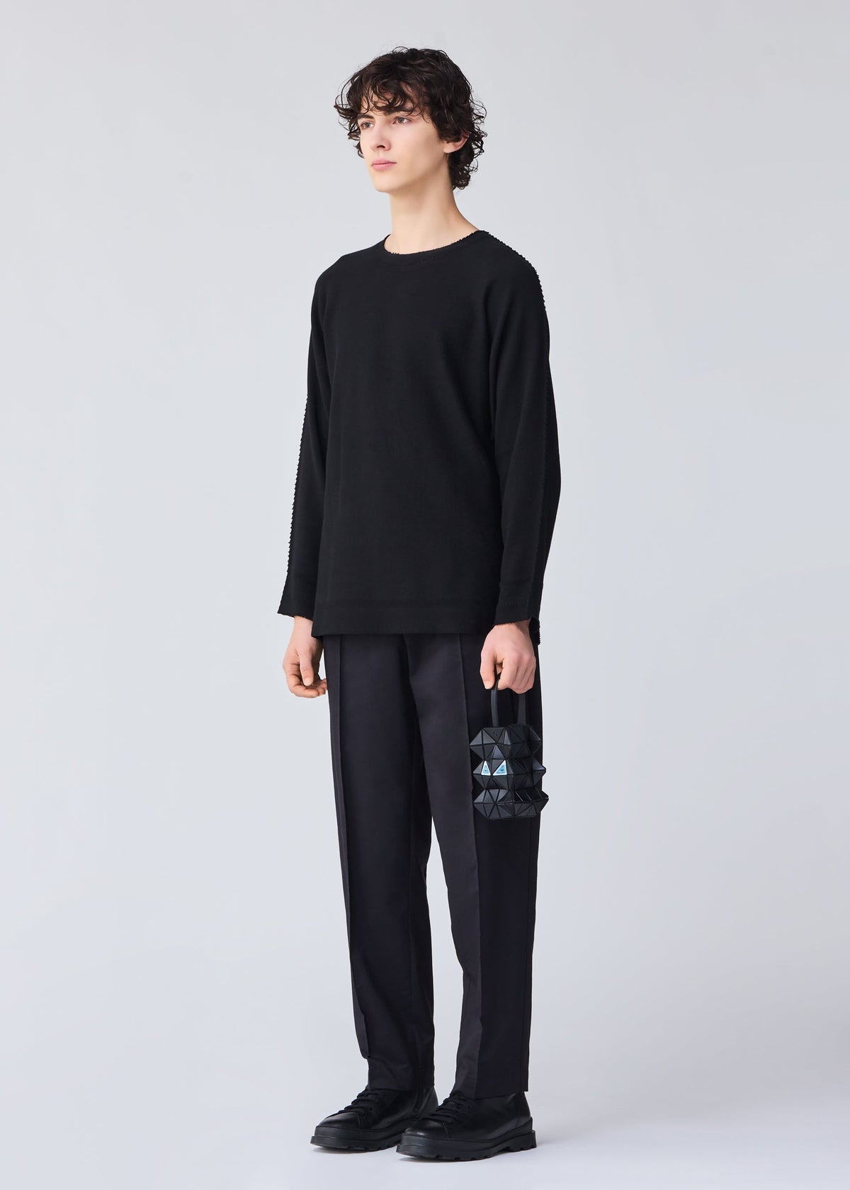 A model wears the BAO BAO ISSEY MIYAKE MEOW 0.