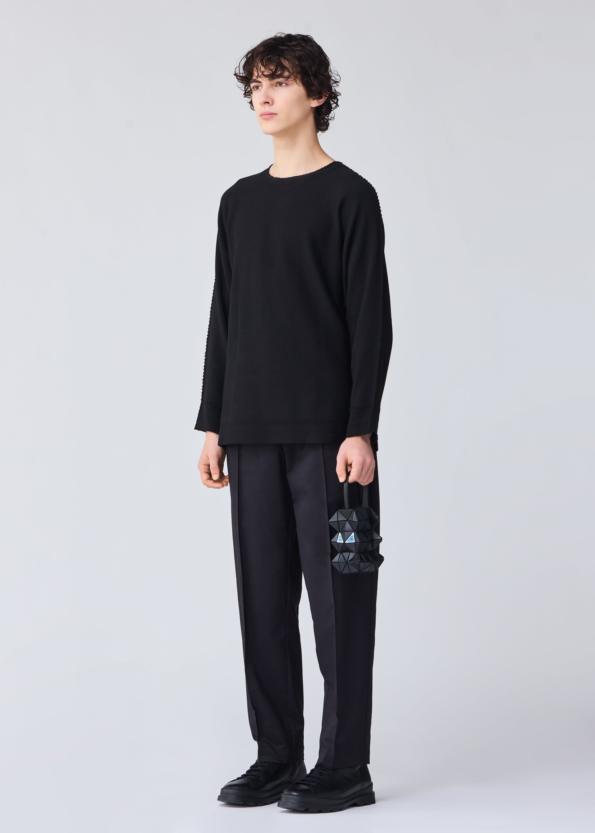 A model wears the BAO BAO ISSEY MIYAKE MEOW 0.