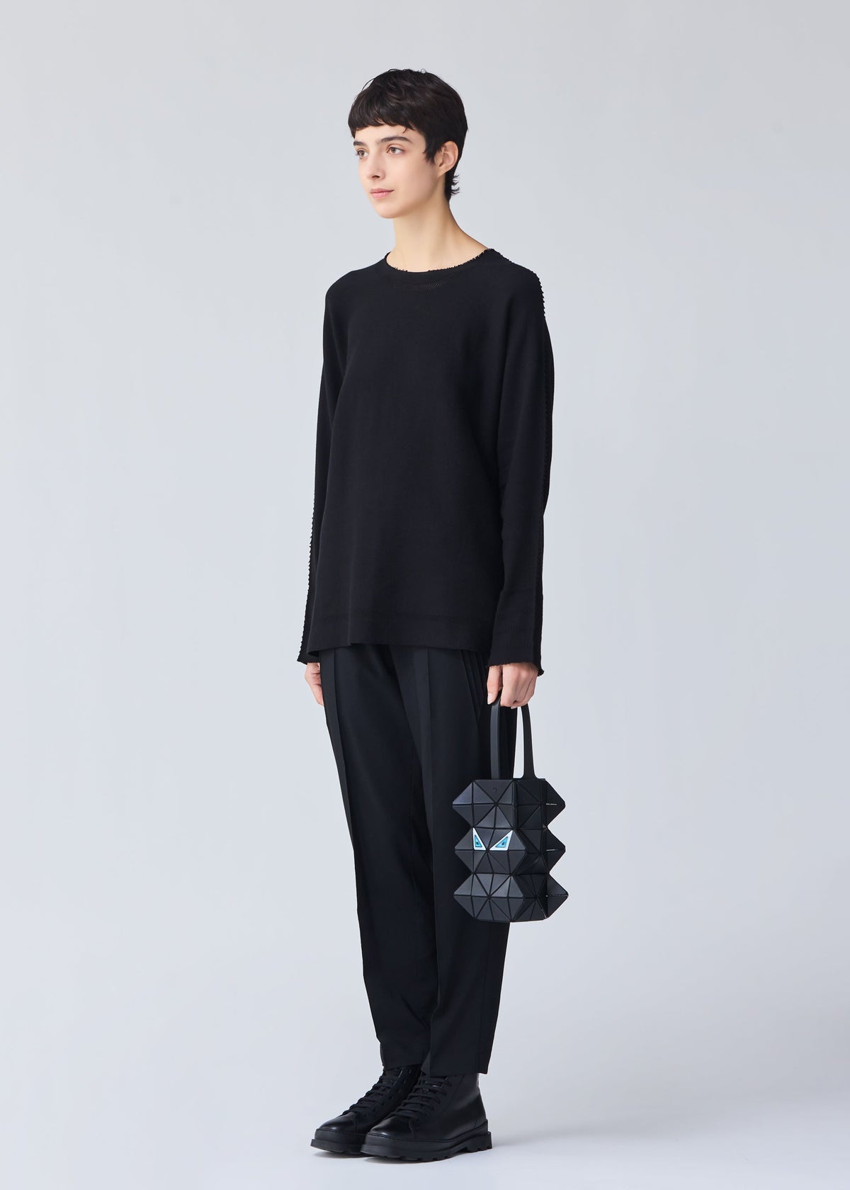 A model wears the BAO BAO ISSEY MIYAKE MEOW 0.