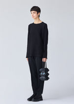 A model wears the BAO BAO ISSEY MIYAKE MEOW 0.