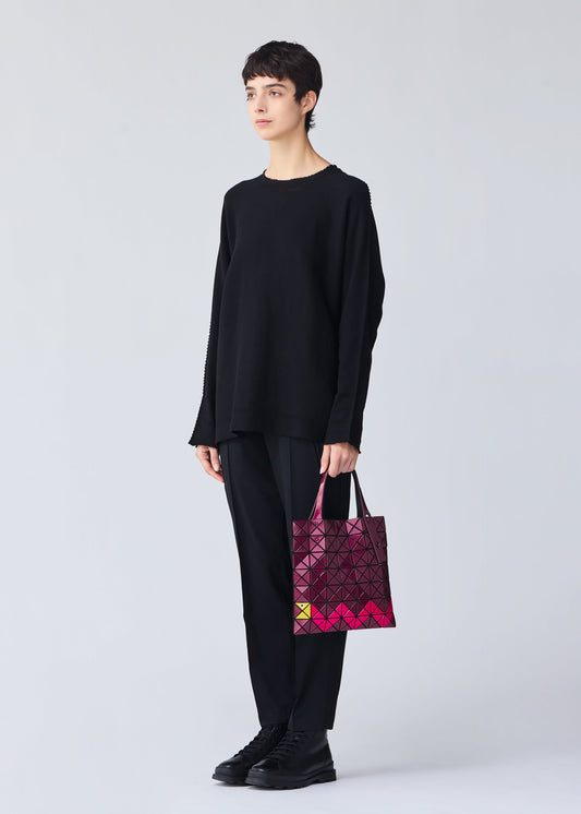 A model wears the BAO BAO ISSEY MIYAKE WONDER tote.