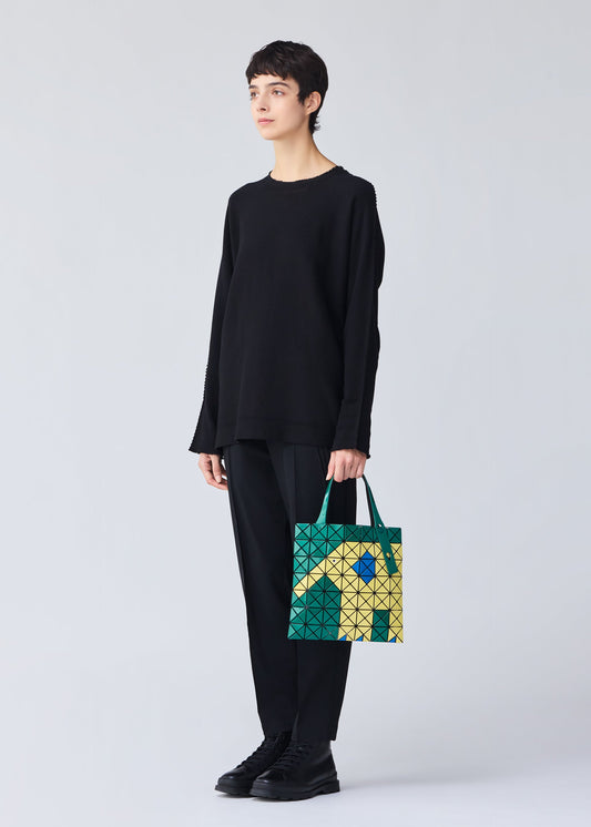 A model wears the BAO BAO ISSEY MIYAKE WONDER tote.
