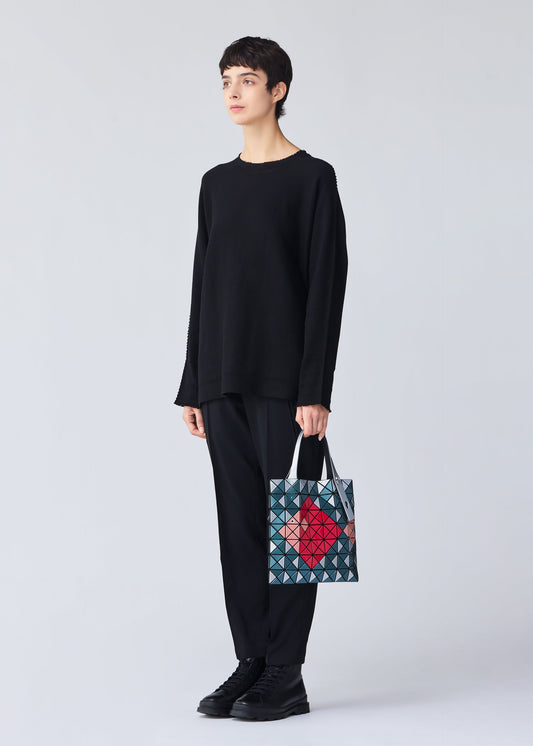 A model wears the BAO BAO ISSEY MIYAKE WONDER tote.