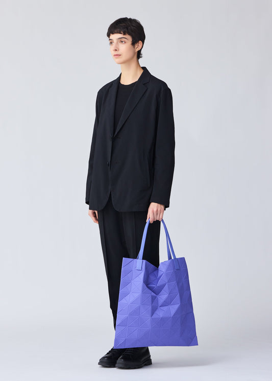 A model wears the BAO BAO ISSEY MIYAKE TRACK tote.