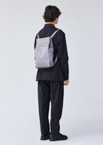 A model wears the BAO BAO ISSEY MIYAKE TRACK backpack.