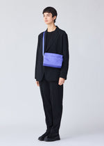 A model wears the BAO BAO ISSEY MIYAKE TRACK shoulder bag.