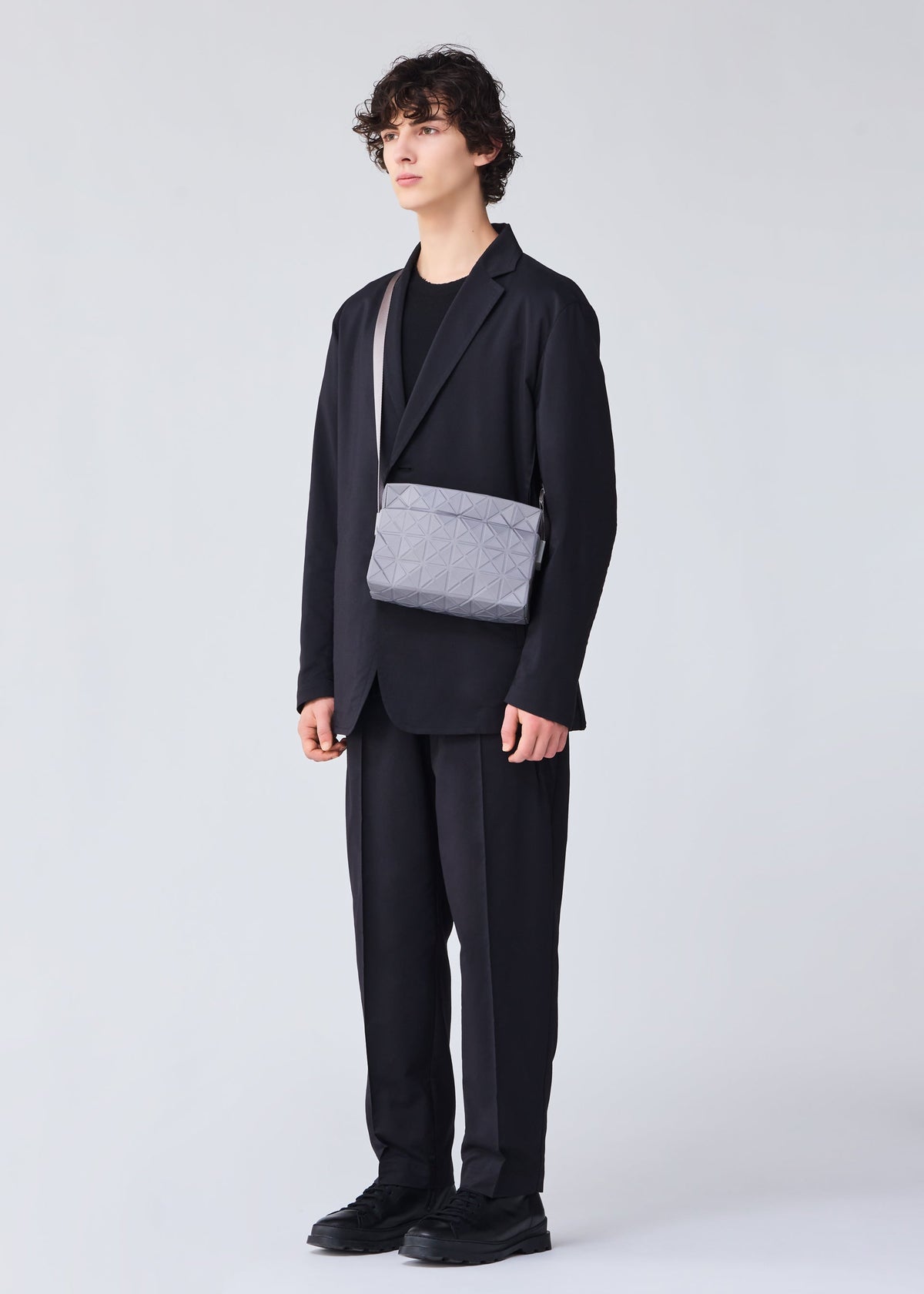 A model wears the BAO BAO ISSEY MIYAKE TRACK shoulder bag.