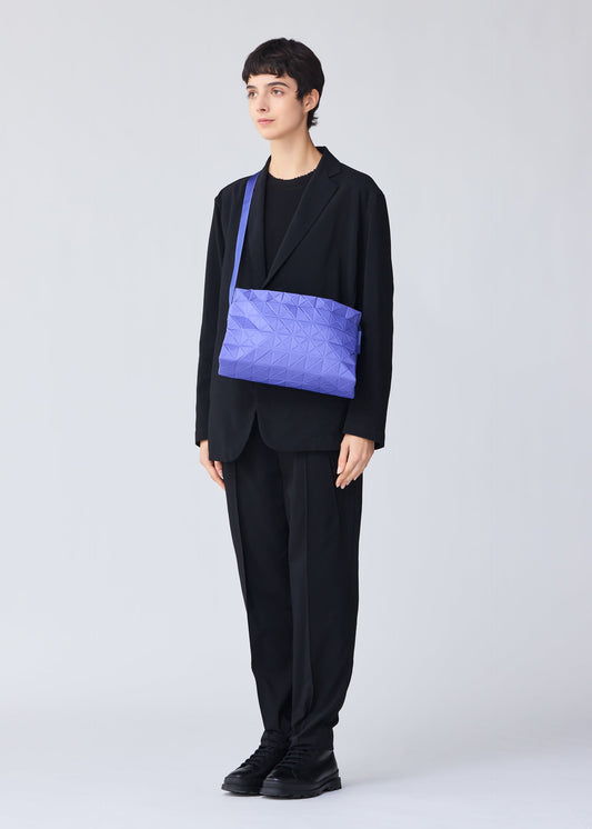 A model wears the BAO BAO ISSEY MIYAKE TRACK shoulder bag.