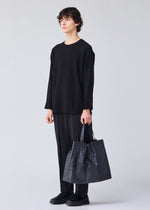 A model wears the BAO BAO ISSEY MIYAKE CART tote.