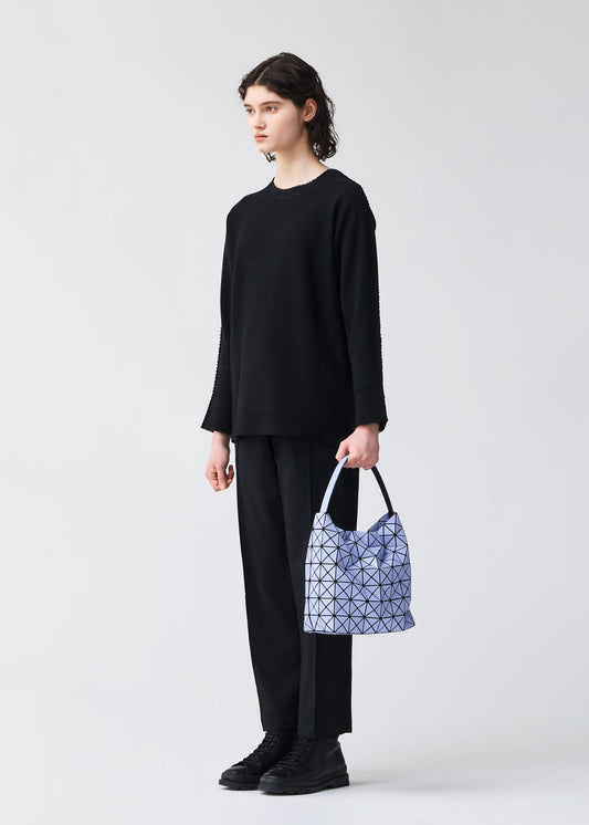 A model wears the BAO BAO ISSEY MIYAKE VALLEY handbag.